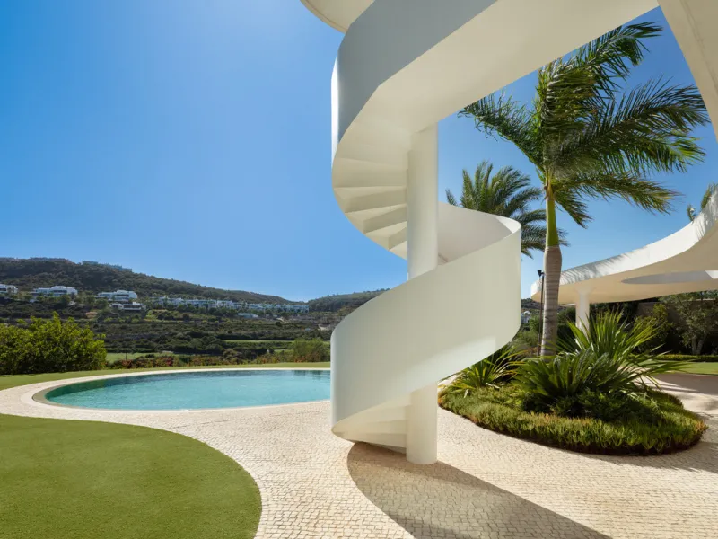 This prestigious villa stands as a testament to architectural ingenuity, capturing the essence of uniqueness and sophistication. Designed by the visionary minds of Vicens & Ramos architects, its futuristic yet nostalgic structure commands attention with i