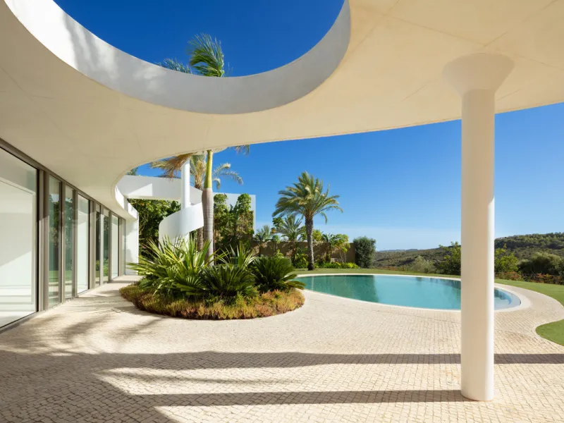 This prestigious villa stands as a testament to architectural ingenuity, capturing the essence of uniqueness and sophistication. Designed by the visionary minds of Vicens & Ramos architects, its futuristic yet nostalgic structure commands attention with i