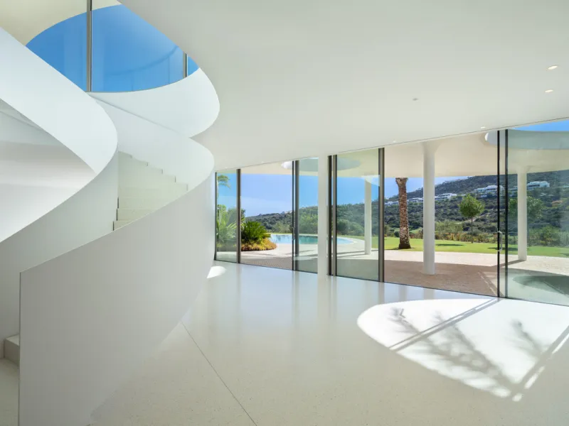 This prestigious villa stands as a testament to architectural ingenuity, capturing the essence of uniqueness and sophistication. Designed by the visionary minds of Vicens & Ramos architects, its futuristic yet nostalgic structure commands attention with i