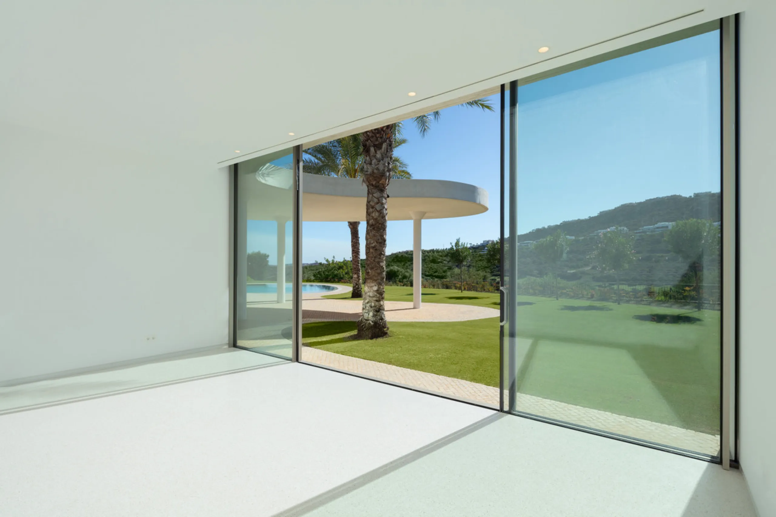 This prestigious villa stands as a testament to architectural ingenuity, capturing the essence of uniqueness and sophistication. Designed by the visionary minds of Vicens & Ramos architects, its futuristic yet nostalgic structure commands attention with i