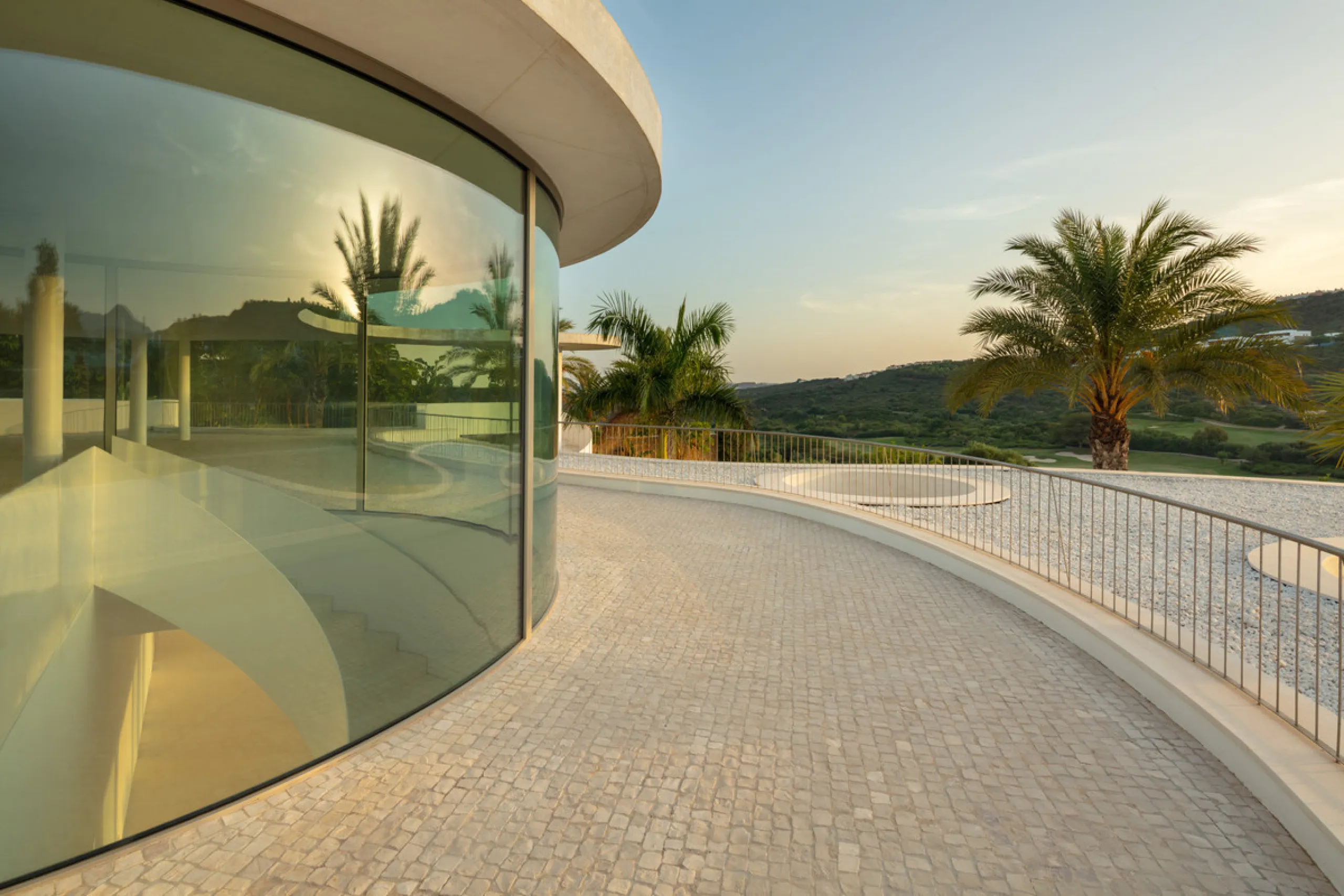 This prestigious villa stands as a testament to architectural ingenuity, capturing the essence of uniqueness and sophistication. Designed by the visionary minds of Vicens & Ramos architects, its futuristic yet nostalgic structure commands attention with i