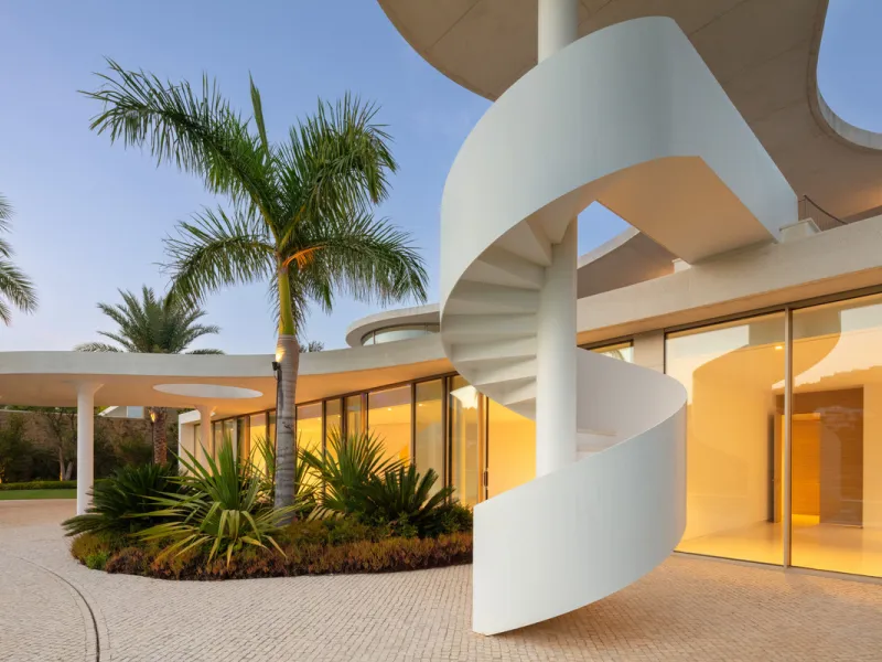 This prestigious villa stands as a testament to architectural ingenuity, capturing the essence of uniqueness and sophistication. Designed by the visionary minds of Vicens & Ramos architects, its futuristic yet nostalgic structure commands attention with i