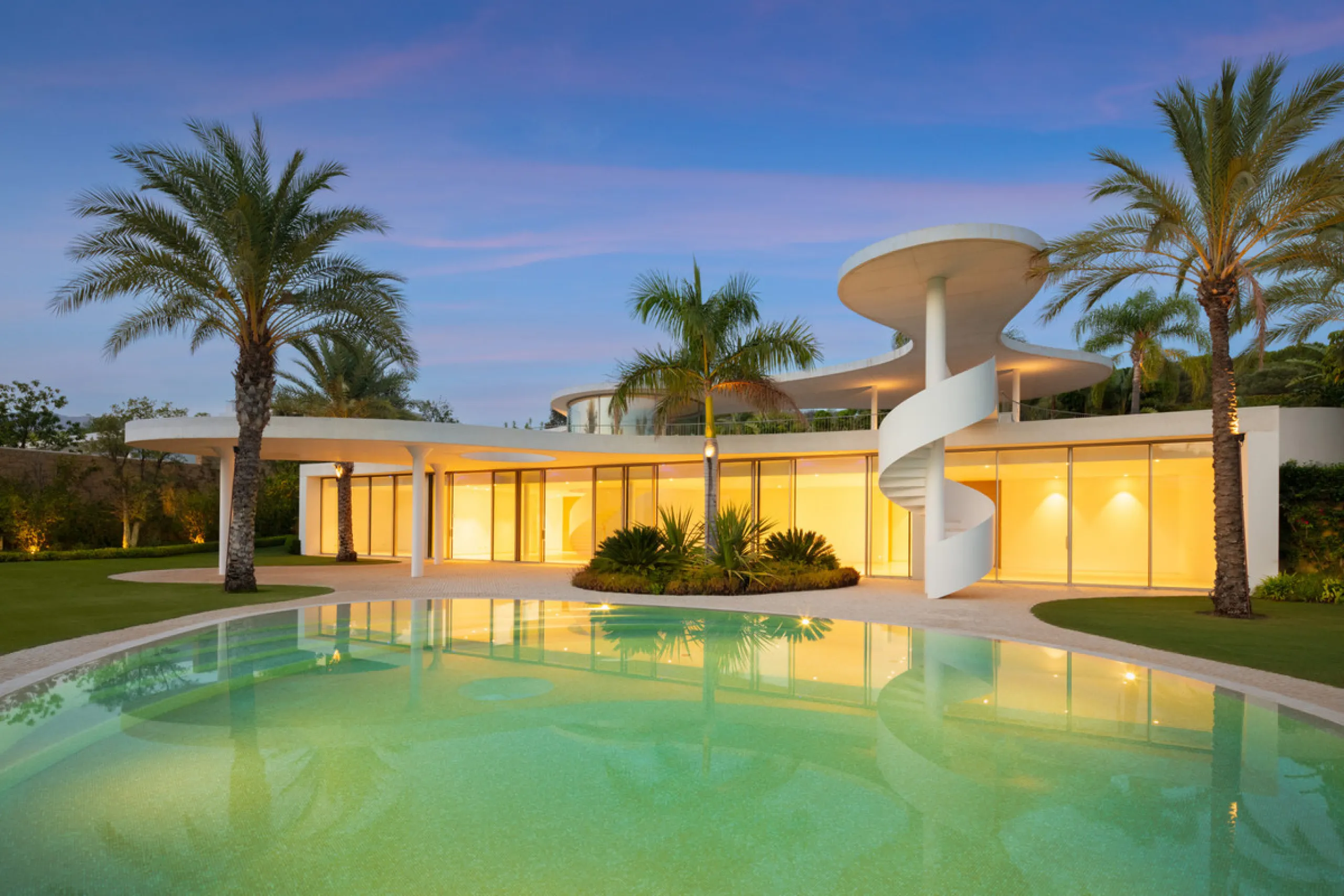 This prestigious villa stands as a testament to architectural ingenuity, capturing the essence of uniqueness and sophistication. Designed by the visionary minds of Vicens & Ramos architects, its futuristic yet nostalgic structure commands attention with i