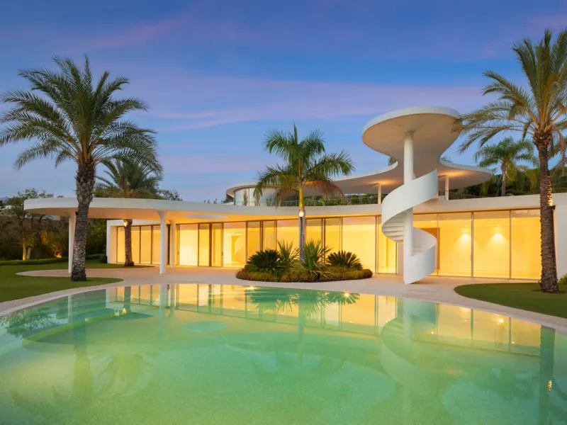 This prestigious villa stands as a testament to architectural ingenuity, capturing the essence of uniqueness and sophistication. Designed by the visionary minds of Vicens & Ramos architects, its futuristic yet nostalgic structure commands attention with i