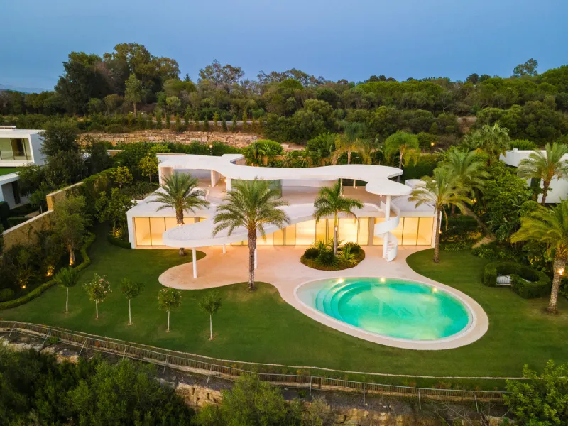 This prestigious villa stands as a testament to architectural ingenuity, capturing the essence of uniqueness and sophistication. Designed by the visionary minds of Vicens & Ramos architects, its futuristic yet nostalgic structure commands attention with i