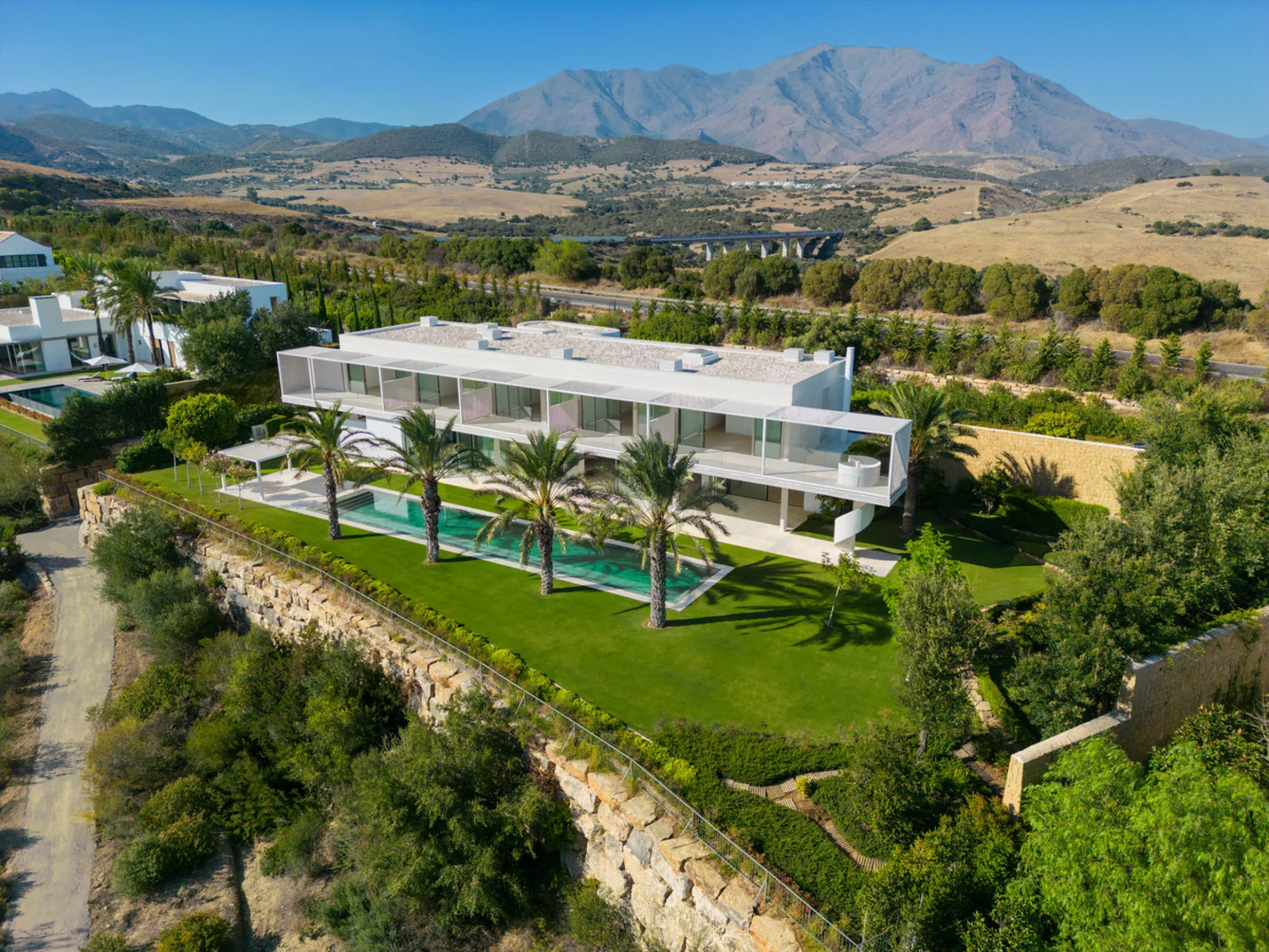 Exuding opulence and refinement, this exceptional villa redefines the very notion of luxury golf resort living. Positioned on an elevated plot, it offers breathtaking panoramic views of the golf course and Mediterranean, while its expansive outdoor areas 