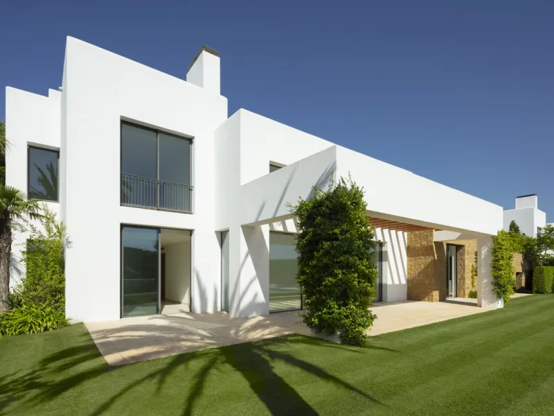 Nestled within the enclave of Green 10 in the Finca Cortesin resort, this villa exudes the charm of Ibiza-style residences. The white structure, adorned with traditional Mediterranean stones, creates a captivating atmosphere for ultimate enjoyment. Set on