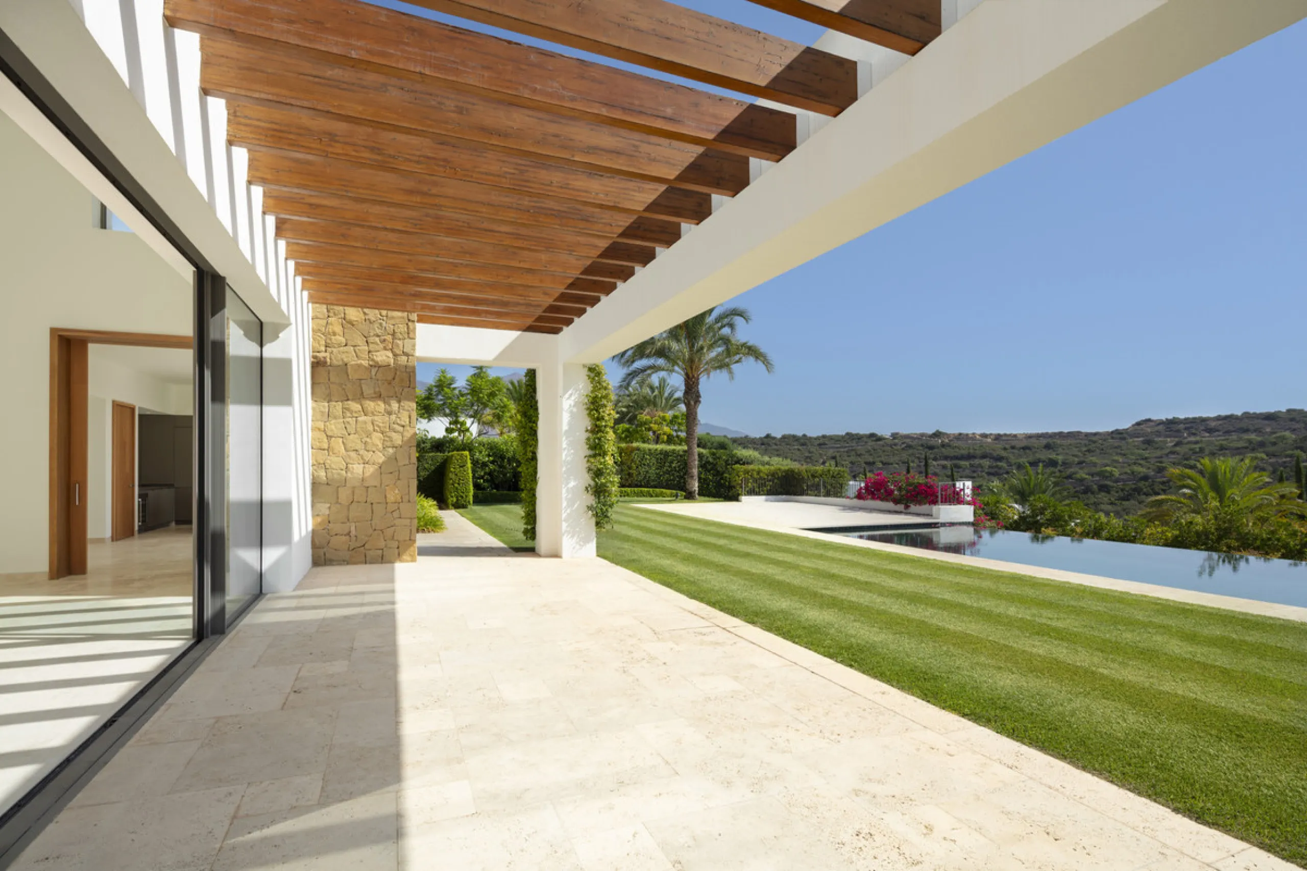 Nestled within the enclave of Green 10 in the Finca Cortesin resort, this villa exudes the charm of Ibiza-style residences. The white structure, adorned with traditional Mediterranean stones, creates a captivating atmosphere for ultimate enjoyment. Set on