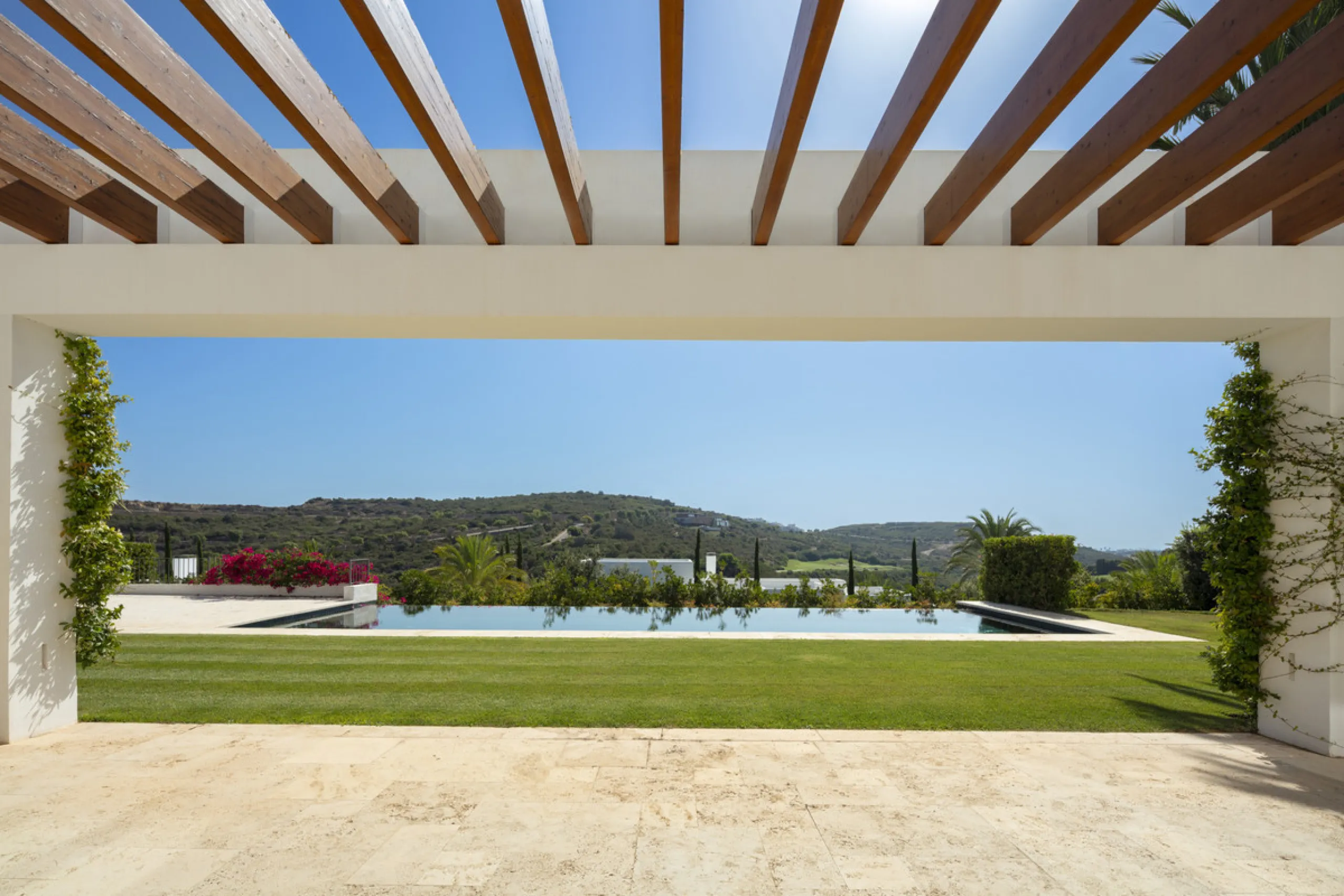 Nestled within the enclave of Green 10 in the Finca Cortesin resort, this villa exudes the charm of Ibiza-style residences. The white structure, adorned with traditional Mediterranean stones, creates a captivating atmosphere for ultimate enjoyment. Set on