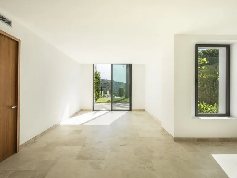 Nestled within the enclave of Green 10 in the Finca Cortesin resort, this villa exudes the charm of Ibiza-style residences. The white structure, adorned with traditional Mediterranean stones, creates a captivating atmosphere for ultimate enjoyment. Set on