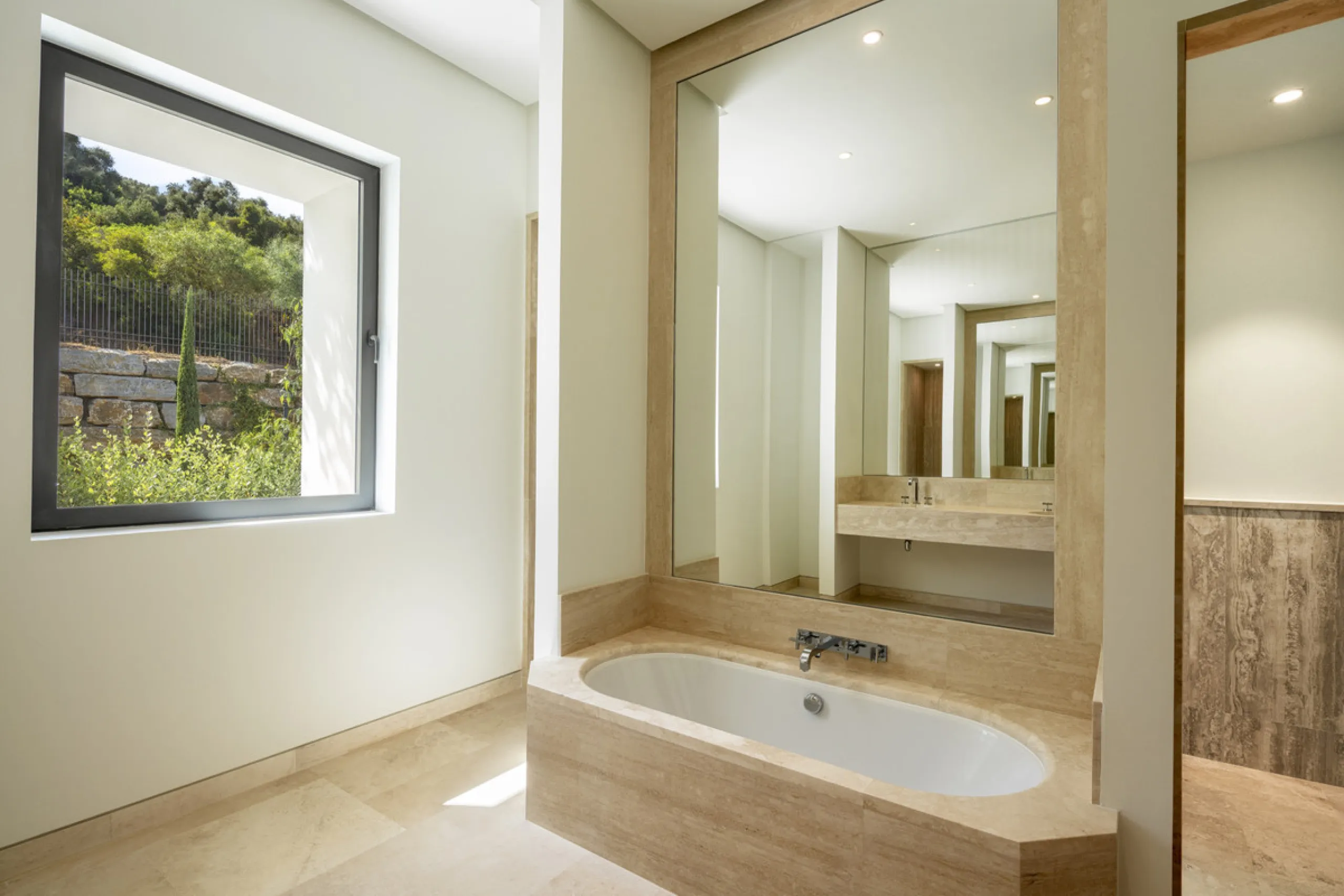 Nestled within the enclave of Green 10 in the Finca Cortesin resort, this villa exudes the charm of Ibiza-style residences. The white structure, adorned with traditional Mediterranean stones, creates a captivating atmosphere for ultimate enjoyment. Set on