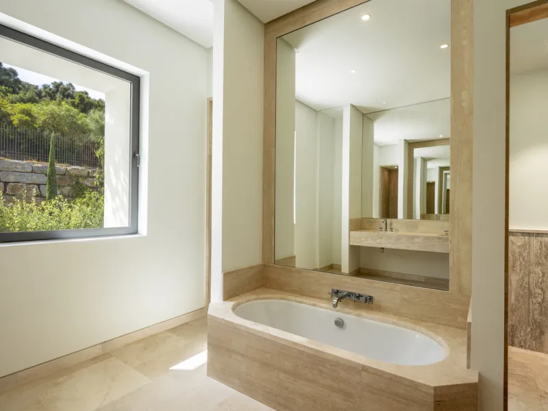 Nestled within the enclave of Green 10 in the Finca Cortesin resort, this villa exudes the charm of Ibiza-style residences. The white structure, adorned with traditional Mediterranean stones, creates a captivating atmosphere for ultimate enjoyment. Set on