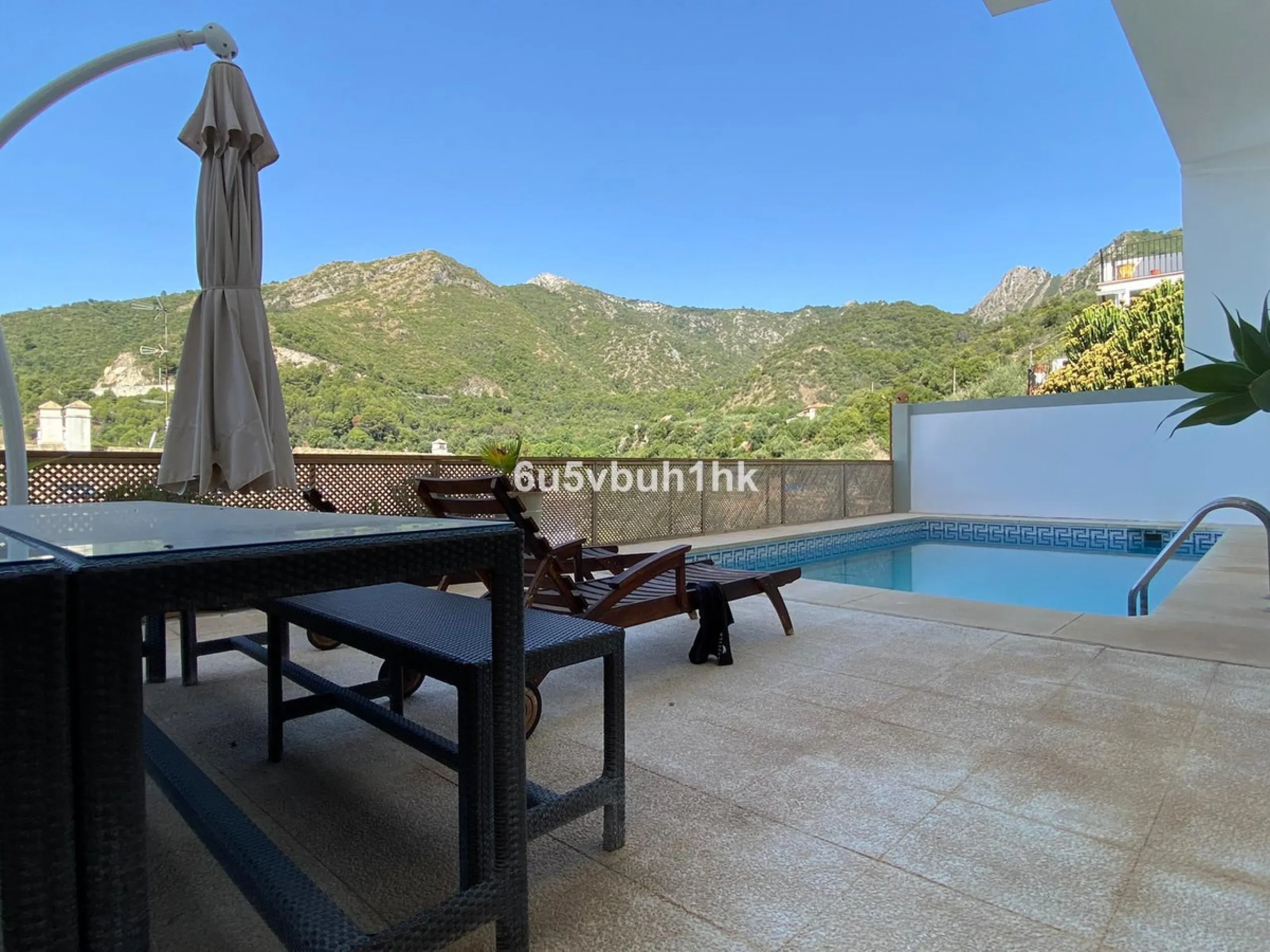 Detached single-family home located in Ojén, distributed over three floors and designed for comfortable and versatile living.