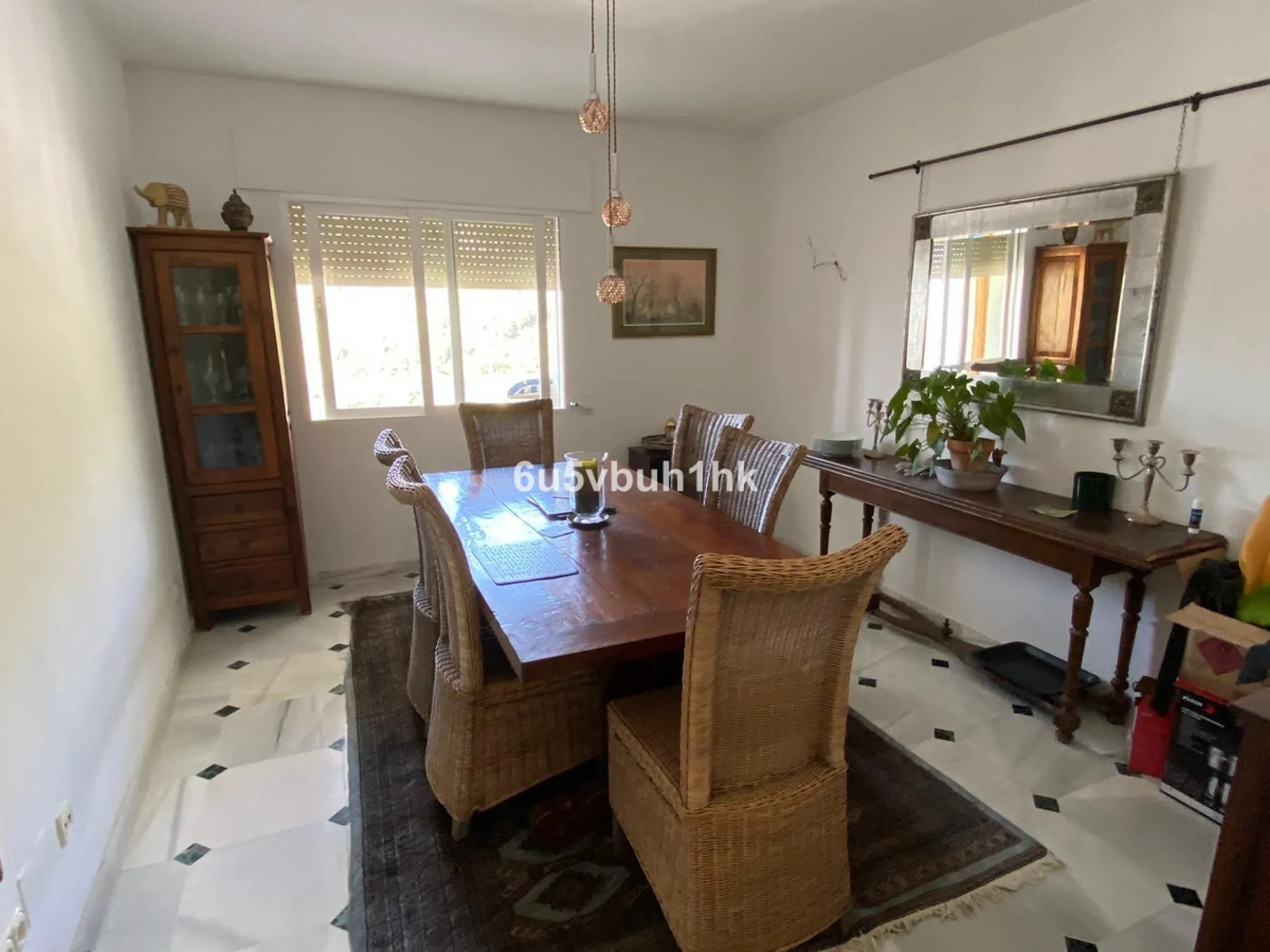 Detached single-family home located in Ojén, distributed over three floors and designed for comfortable and versatile living.
