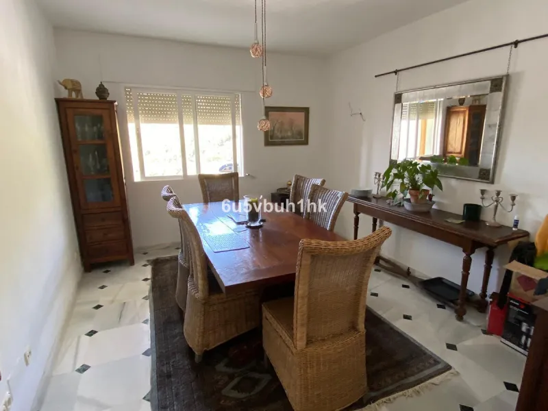 Detached single-family home located in Ojén, distributed over three floors and designed for comfortable and versatile living.