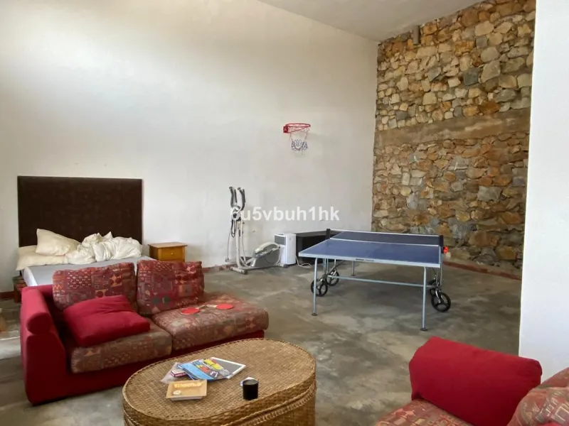 Detached single-family home located in Ojén, distributed over three floors and designed for comfortable and versatile living.