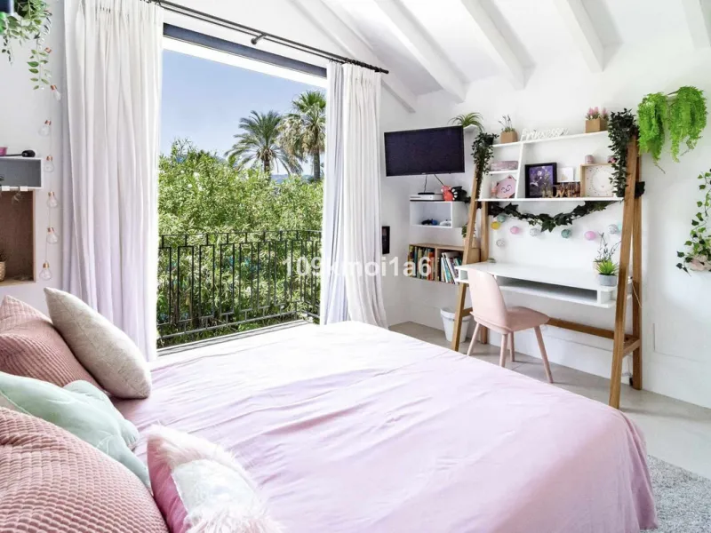 This elegant south east-facing villa is set within a quiet cul-de-sac in Las Brisas, Nueva Andalucía, offering privacy, mature gardens, and open views enhanced by abundant natural light throughout the day. The property blends the charm of a timeless Andal