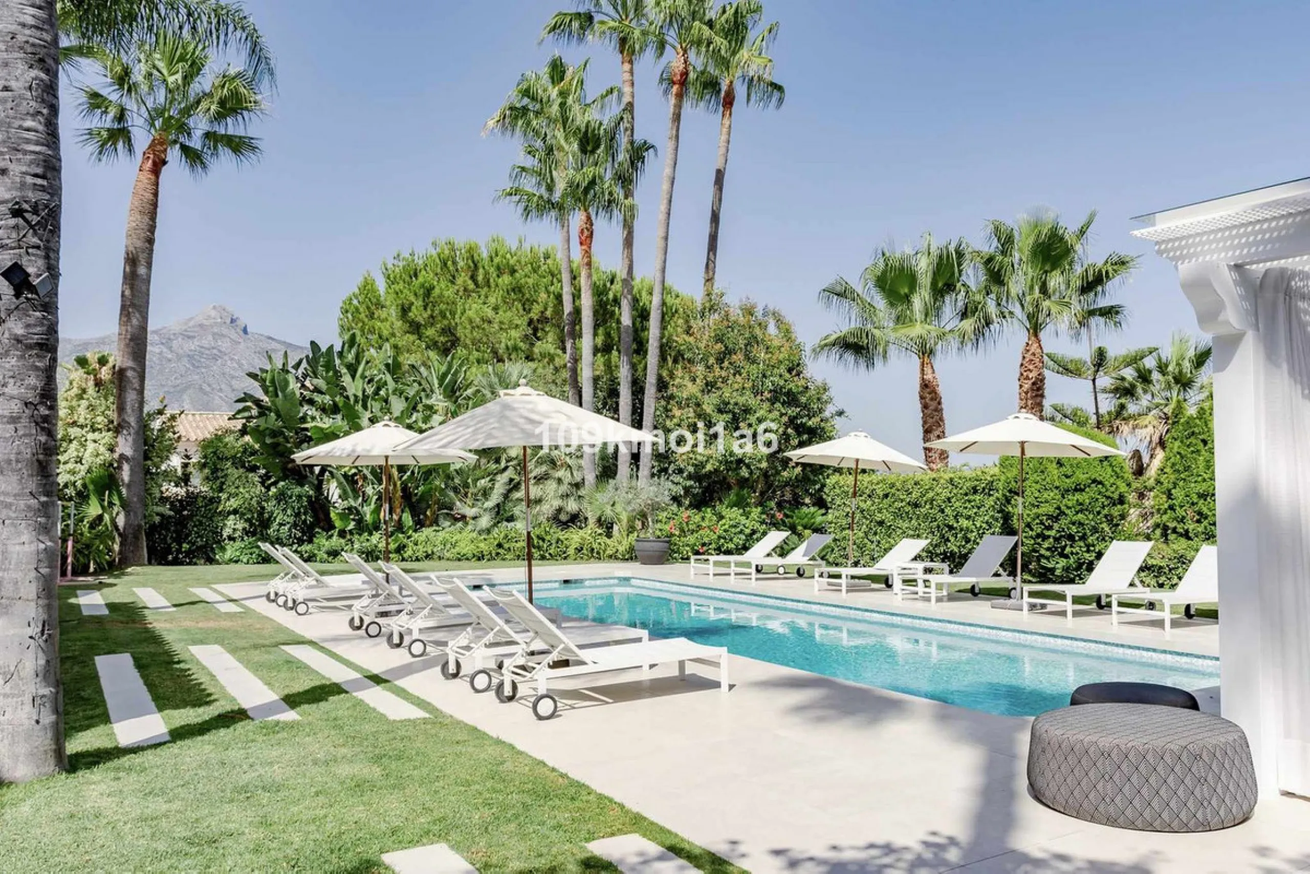 This elegant south east-facing villa is set within a quiet cul-de-sac in Las Brisas, Nueva Andalucía, offering privacy, mature gardens, and open views enhanced by abundant natural light throughout the day. The property blends the charm of a timeless Andal