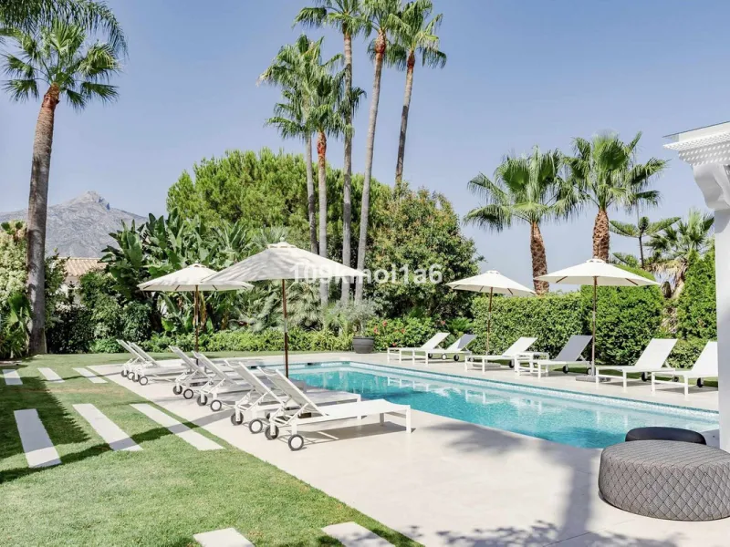 This elegant south east-facing villa is set within a quiet cul-de-sac in Las Brisas, Nueva Andalucía, offering privacy, mature gardens, and open views enhanced by abundant natural light throughout the day. The property blends the charm of a timeless Andal