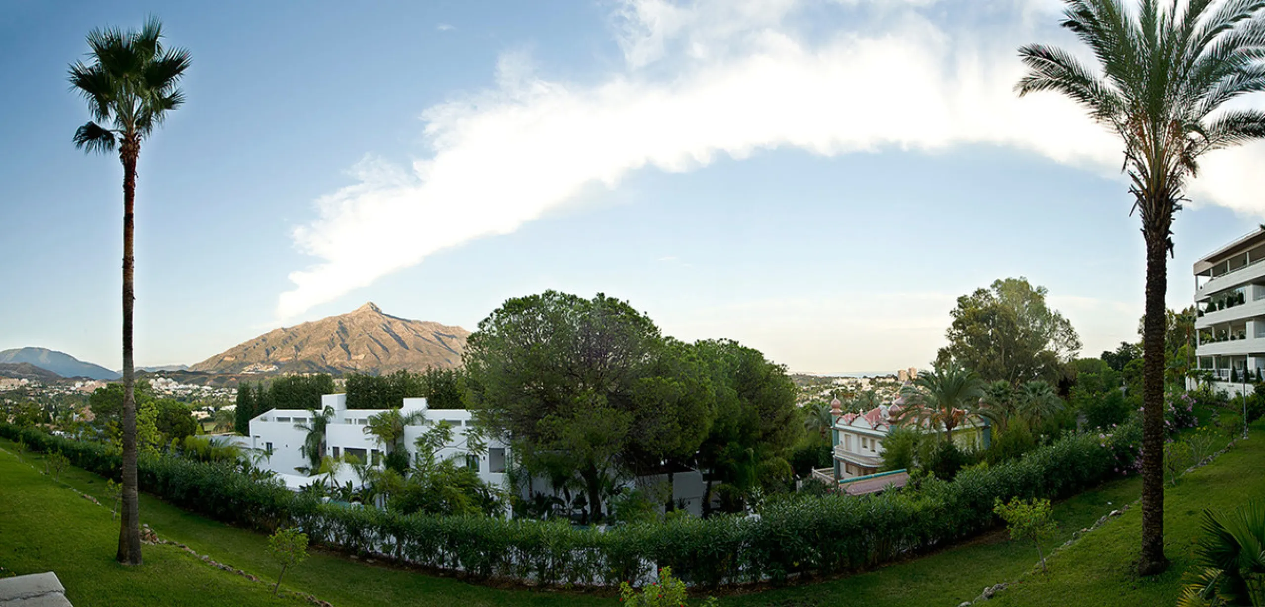 Apartment La Corniche is a luxury 2-bedroom apartment in the heart of Nueva Andalucía's Golf Valley. This gated community offers peace and privacy while being close to world-class golf, fine dining, and Puerto Banús. The home enjoys 180-degree views of th