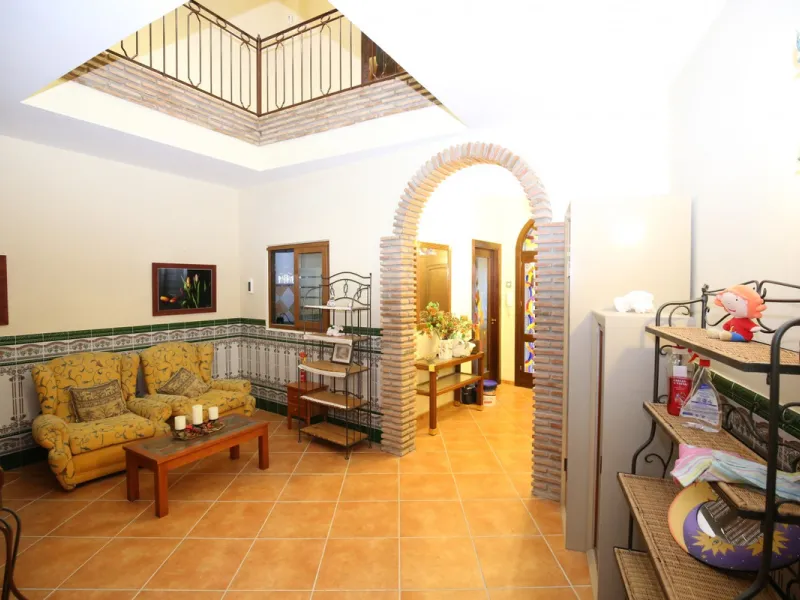 In the picturesque village of Benamargosa, a spacious house with an impressive built area of 472 m2 is available for sale. Its prime location allows easy access on foot to all the amenities the village has to offer, including restaurants, shops, and medic