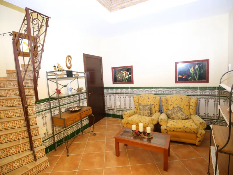 In the picturesque village of Benamargosa, a spacious house with an impressive built area of 472 m2 is available for sale. Its prime location allows easy access on foot to all the amenities the village has to offer, including restaurants, shops, and medic