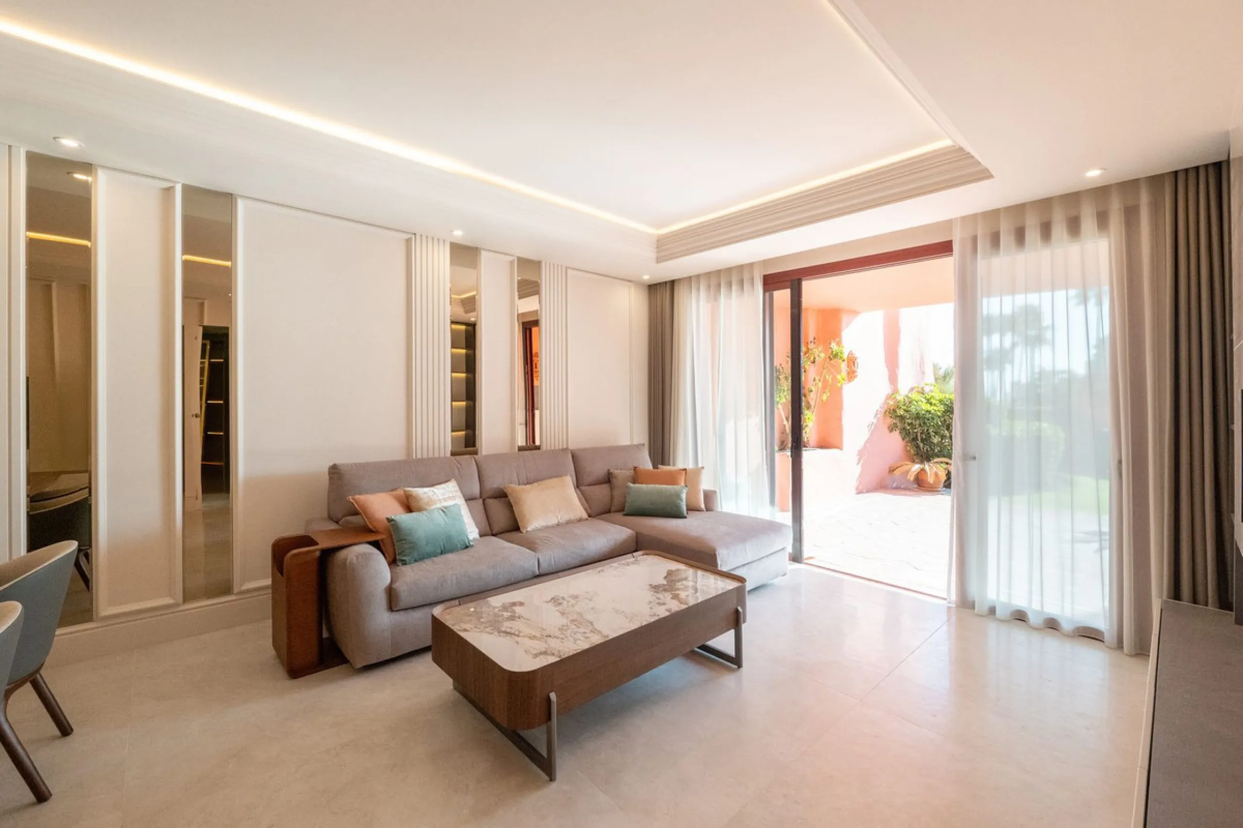Situated in Cabo Bermejo, an exclusive frontline beach development positioned along the New Golden Mile stretching between San Pedro and Estepona, this recently refurbished ground-floor apartment boasts three bedrooms and two bathrooms, providing a sophis