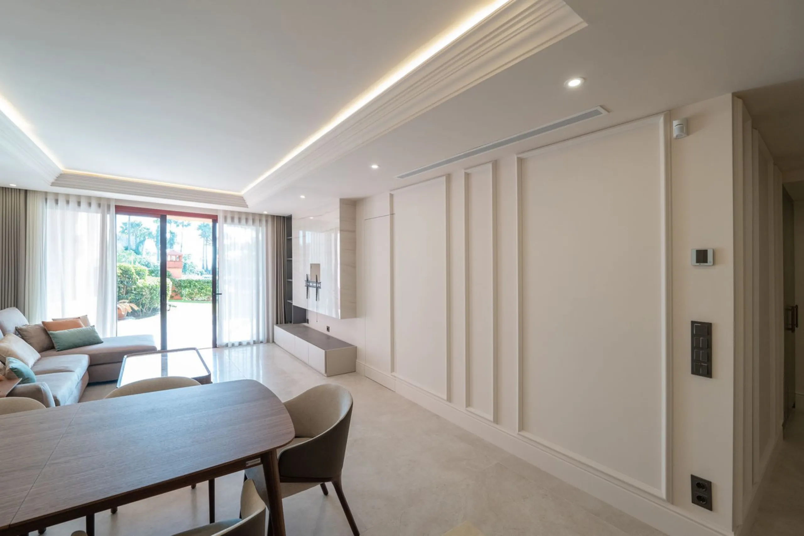 Situated in Cabo Bermejo, an exclusive frontline beach development positioned along the New Golden Mile stretching between San Pedro and Estepona, this recently refurbished ground-floor apartment boasts three bedrooms and two bathrooms, providing a sophis
