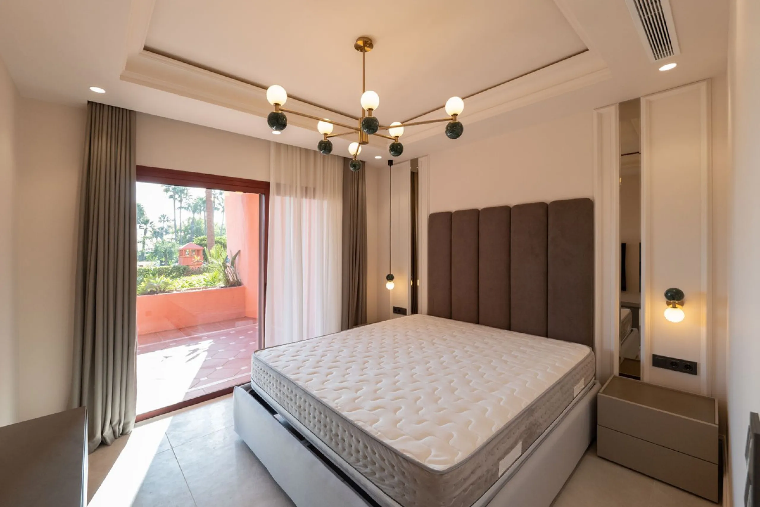 Situated in Cabo Bermejo, an exclusive frontline beach development positioned along the New Golden Mile stretching between San Pedro and Estepona, this recently refurbished ground-floor apartment boasts three bedrooms and two bathrooms, providing a sophis