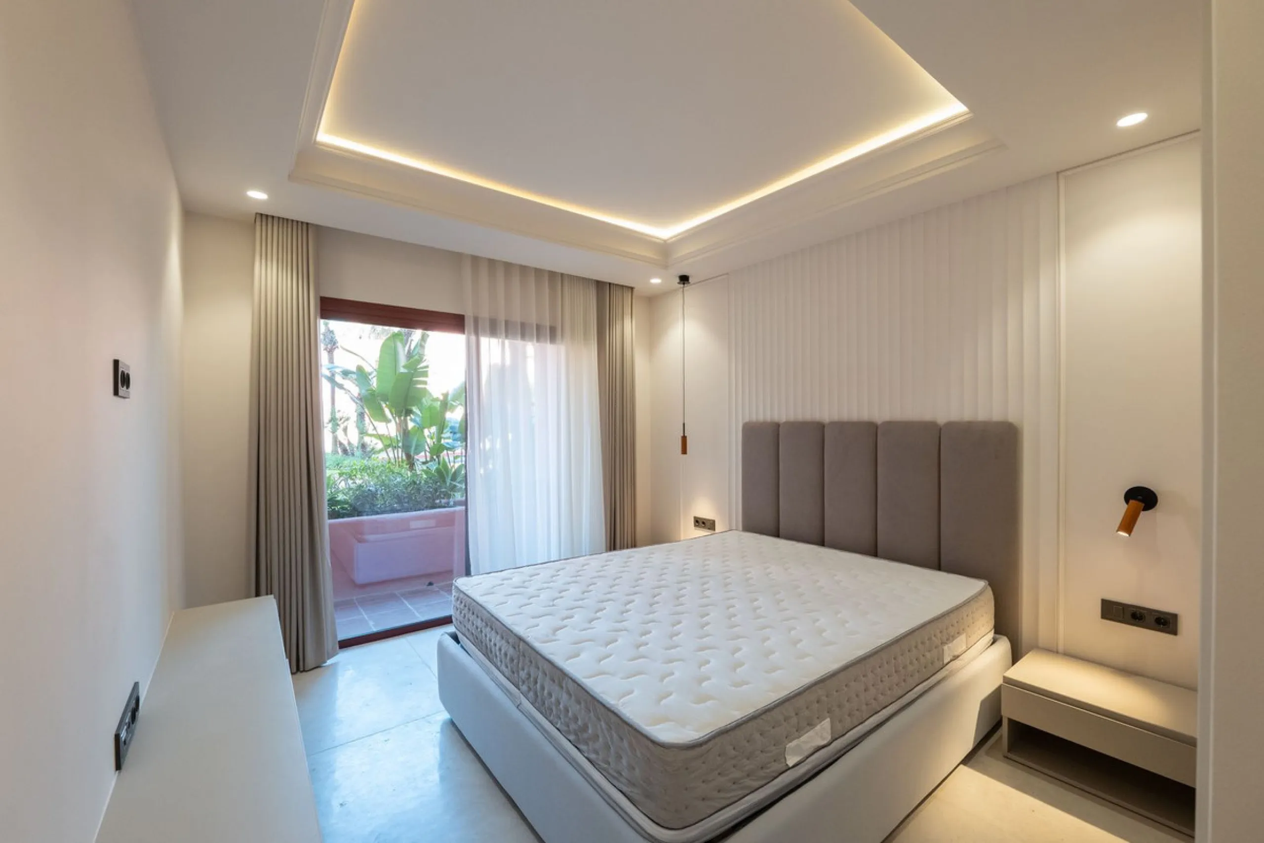 Situated in Cabo Bermejo, an exclusive frontline beach development positioned along the New Golden Mile stretching between San Pedro and Estepona, this recently refurbished ground-floor apartment boasts three bedrooms and two bathrooms, providing a sophis