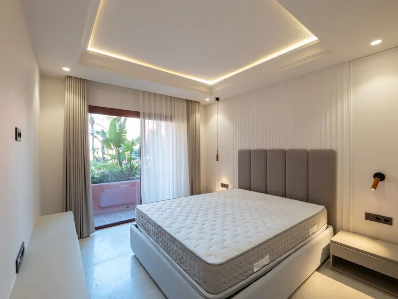 Situated in Cabo Bermejo, an exclusive frontline beach development positioned along the New Golden Mile stretching between San Pedro and Estepona, this recently refurbished ground-floor apartment boasts three bedrooms and two bathrooms, providing a sophis