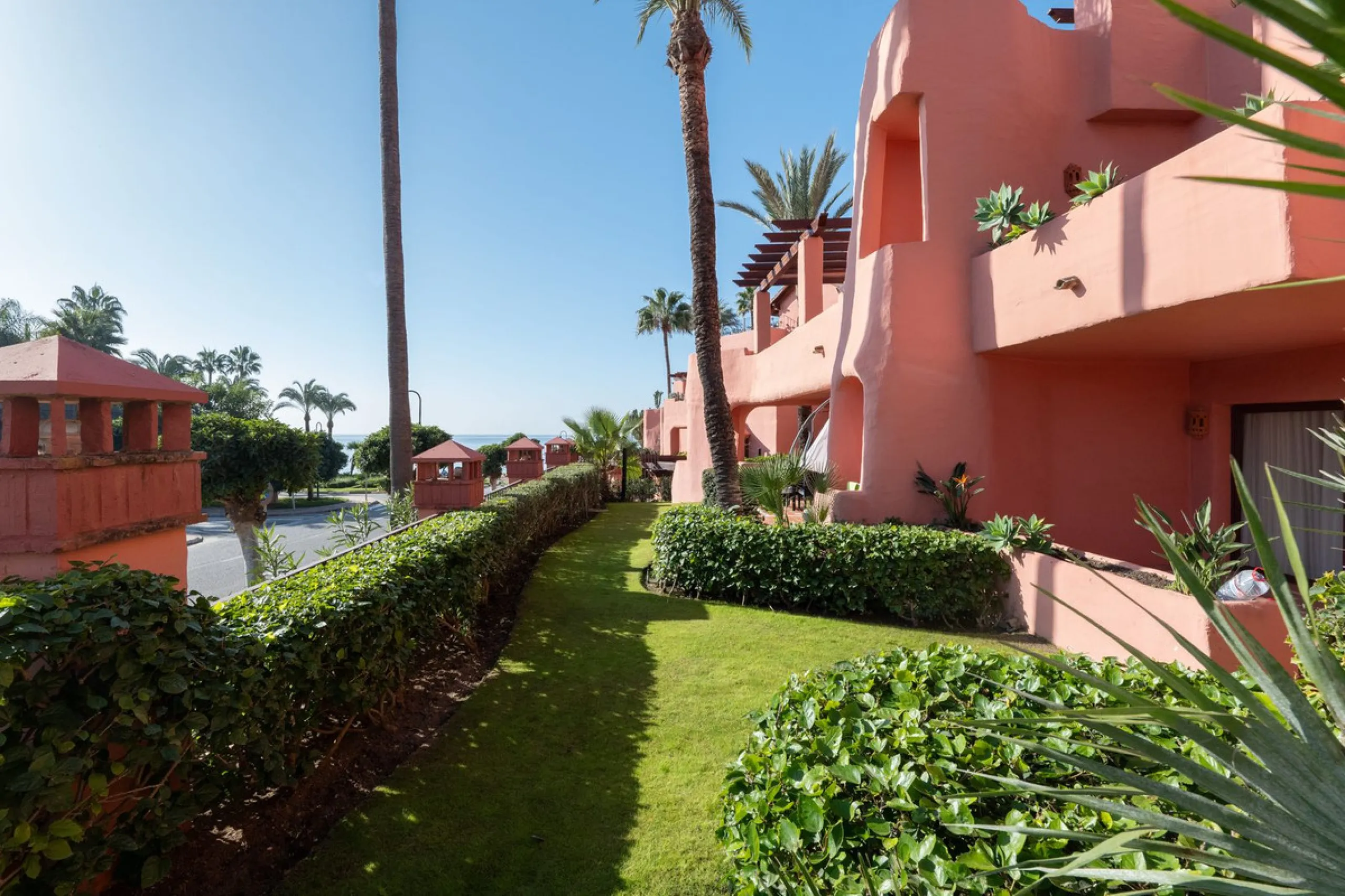 Situated in Cabo Bermejo, an exclusive frontline beach development positioned along the New Golden Mile stretching between San Pedro and Estepona, this recently refurbished ground-floor apartment boasts three bedrooms and two bathrooms, providing a sophis