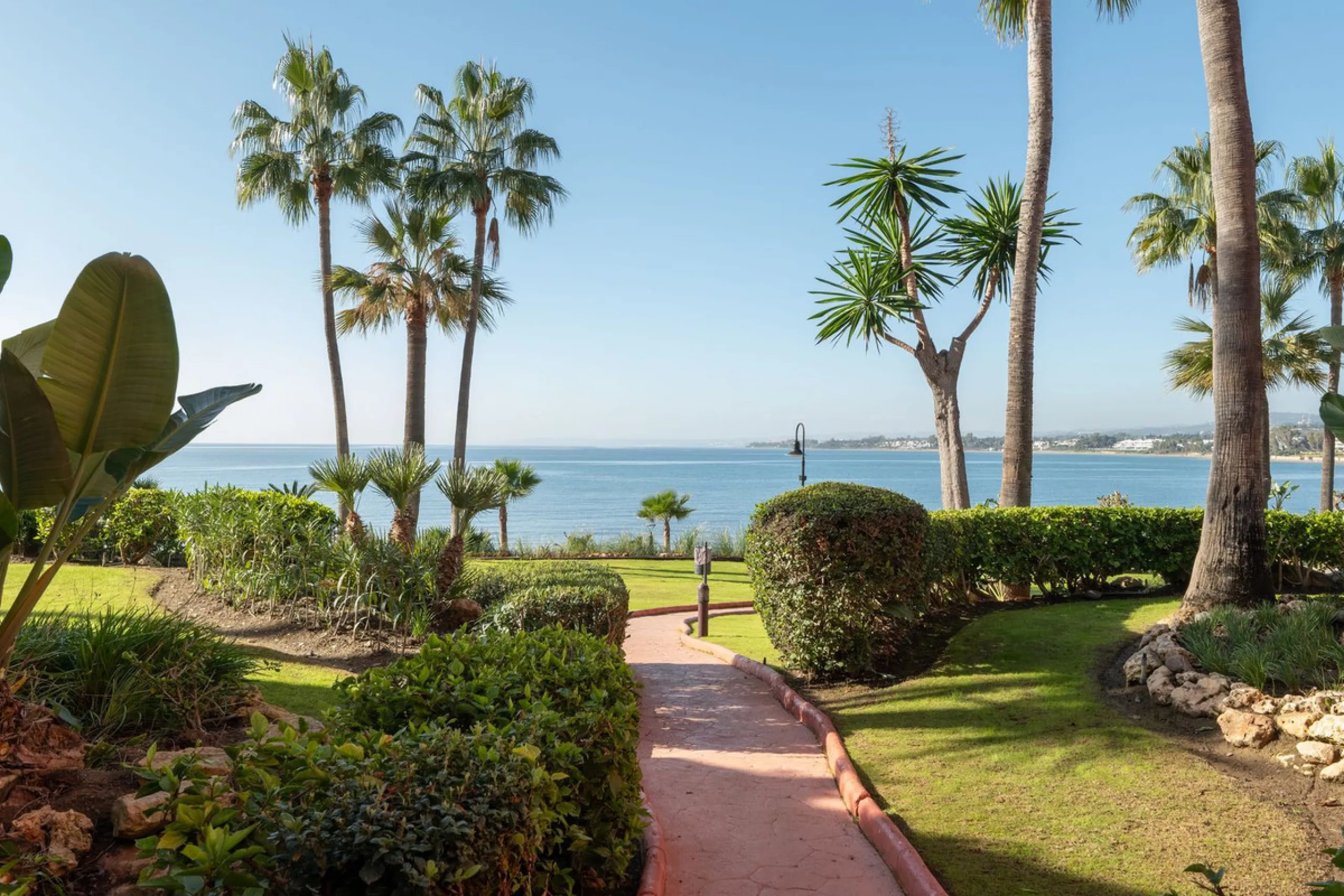 Situated in Cabo Bermejo, an exclusive frontline beach development positioned along the New Golden Mile stretching between San Pedro and Estepona, this recently refurbished ground-floor apartment boasts three bedrooms and two bathrooms, providing a sophis