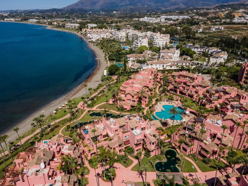 Situated in Cabo Bermejo, an exclusive frontline beach development positioned along the New Golden Mile stretching between San Pedro and Estepona, this recently refurbished ground-floor apartment boasts three bedrooms and two bathrooms, providing a sophis