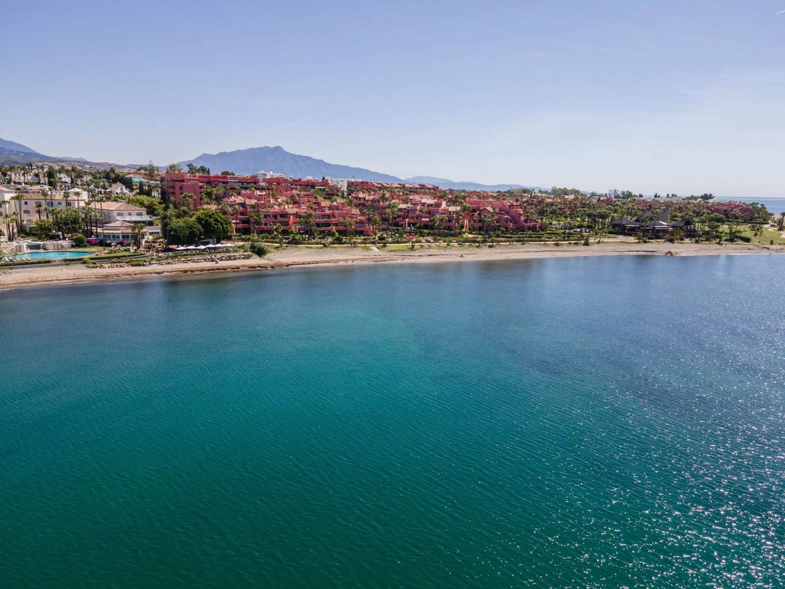 Situated in Cabo Bermejo, an exclusive frontline beach development positioned along the New Golden Mile stretching between San Pedro and Estepona, this recently refurbished ground-floor apartment boasts three bedrooms and two bathrooms, providing a sophis