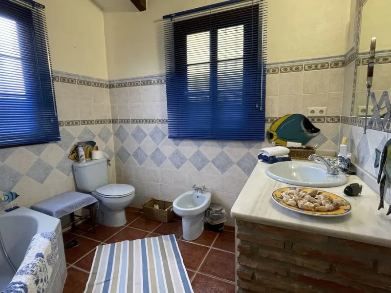 Immerse yourself in the captivating charm of this refined utterly peaceful country home, affording absolute privacy and breathtaking panoramic views, which unfold before you as far as the sea and the Sierra de Ronda. The beach, several golf courses, ridin