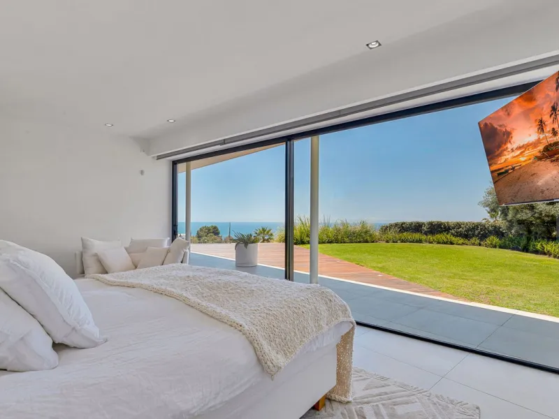 Contemporary designer villa with breathtaking views towards the sea. The villa comprises of two floors with main entrance on the upper level. From the moment you step through the front door, you are struck by the fantastic view thanks to the floor-to-ceil