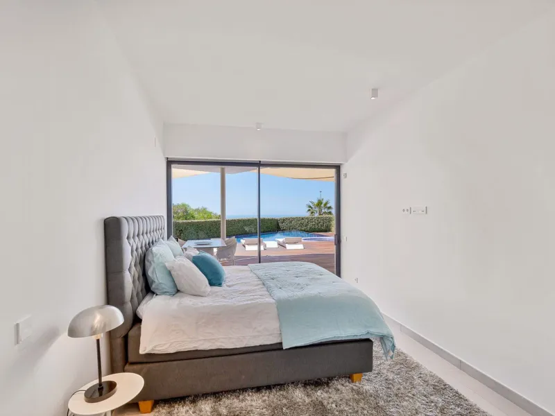 Contemporary designer villa with breathtaking views towards the sea. The villa comprises of two floors with main entrance on the upper level. From the moment you step through the front door, you are struck by the fantastic view thanks to the floor-to-ceil