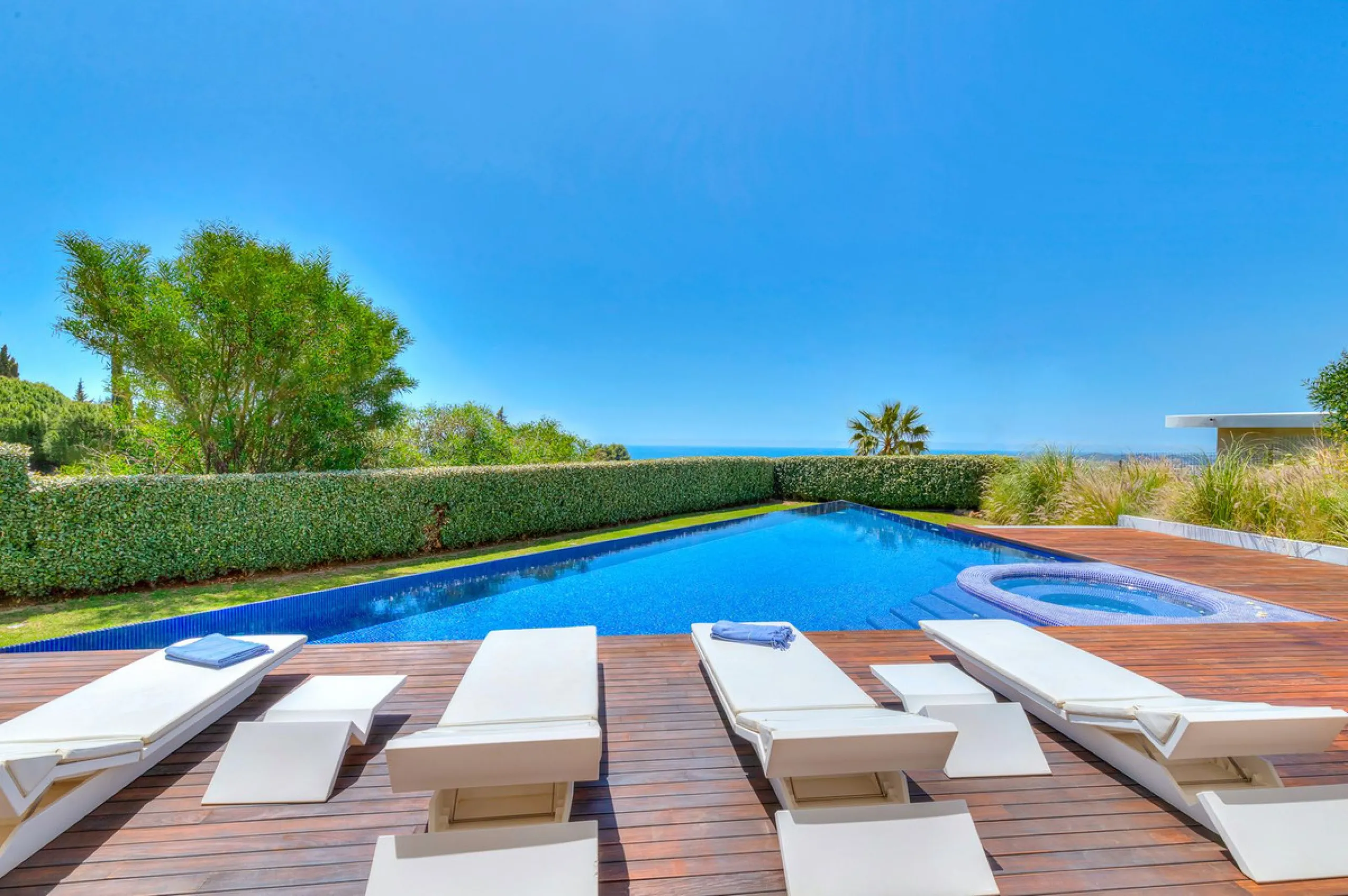 Contemporary designer villa with breathtaking views towards the sea. The villa comprises of two floors with main entrance on the upper level. From the moment you step through the front door, you are struck by the fantastic view thanks to the floor-to-ceil