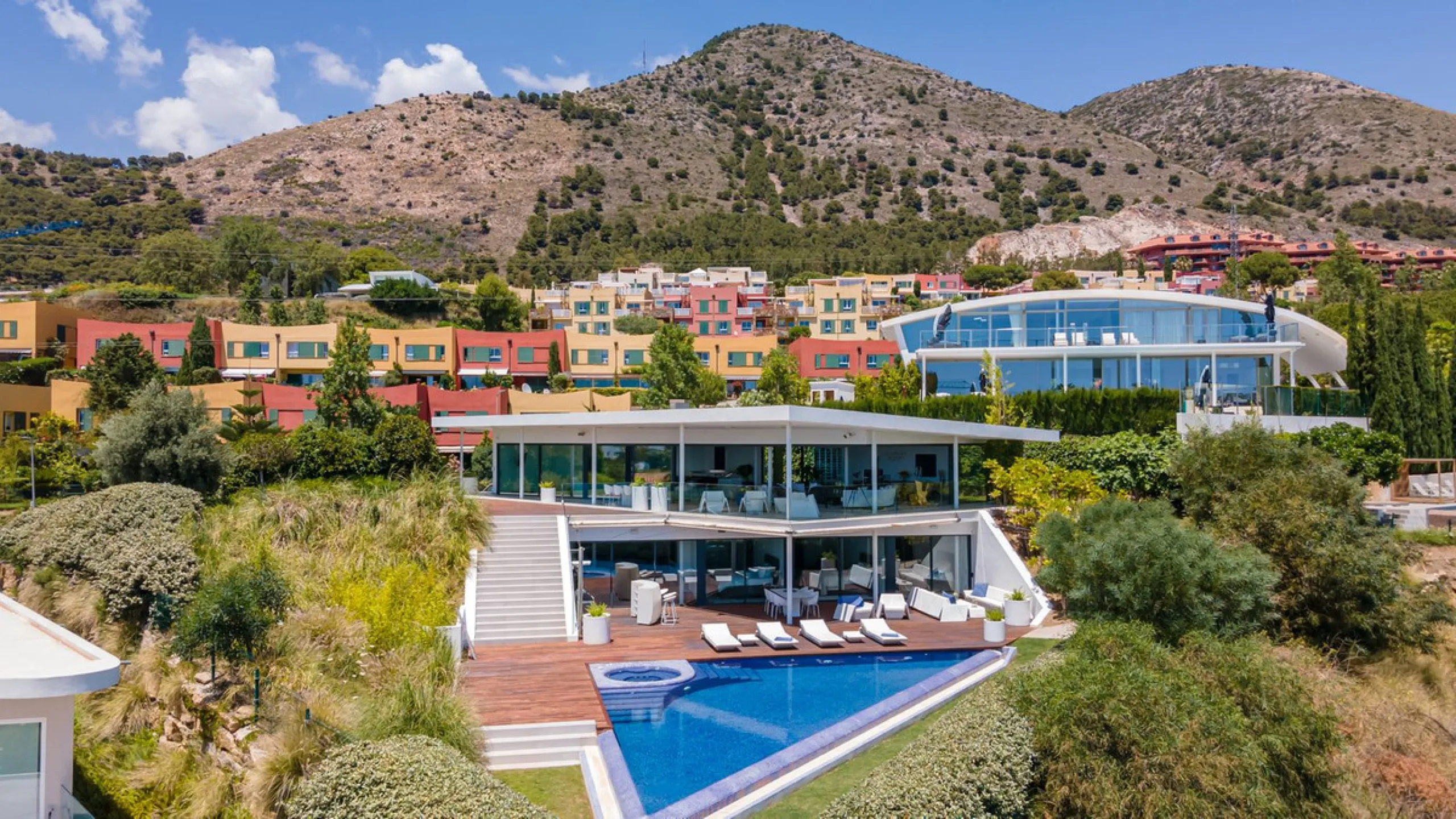 Contemporary designer villa with breathtaking views towards the sea. The villa comprises of two floors with main entrance on the upper level. From the moment you step through the front door, you are struck by the fantastic view thanks to the floor-to-ceil