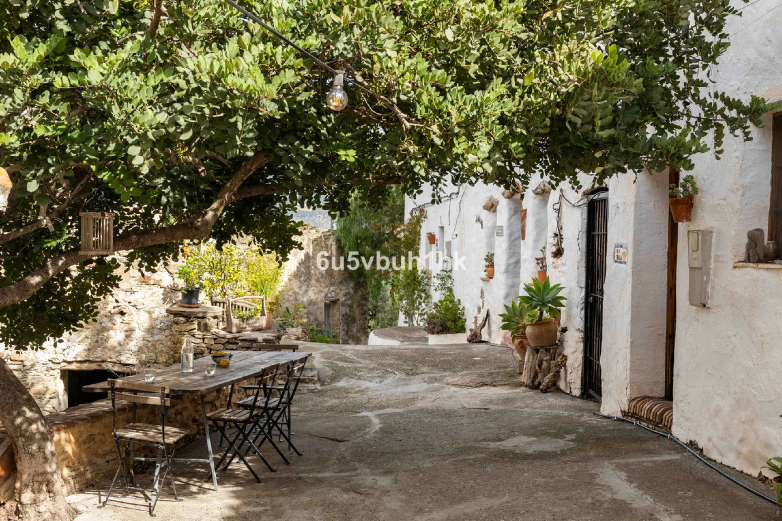 A very rare opportunity to purchase  a complete private village of 14 townhouses situated in what was once a functioning white countryside hamlet overlooking the lake with a lovely cobbled street leading to each house. These beautiful rustic style houses 