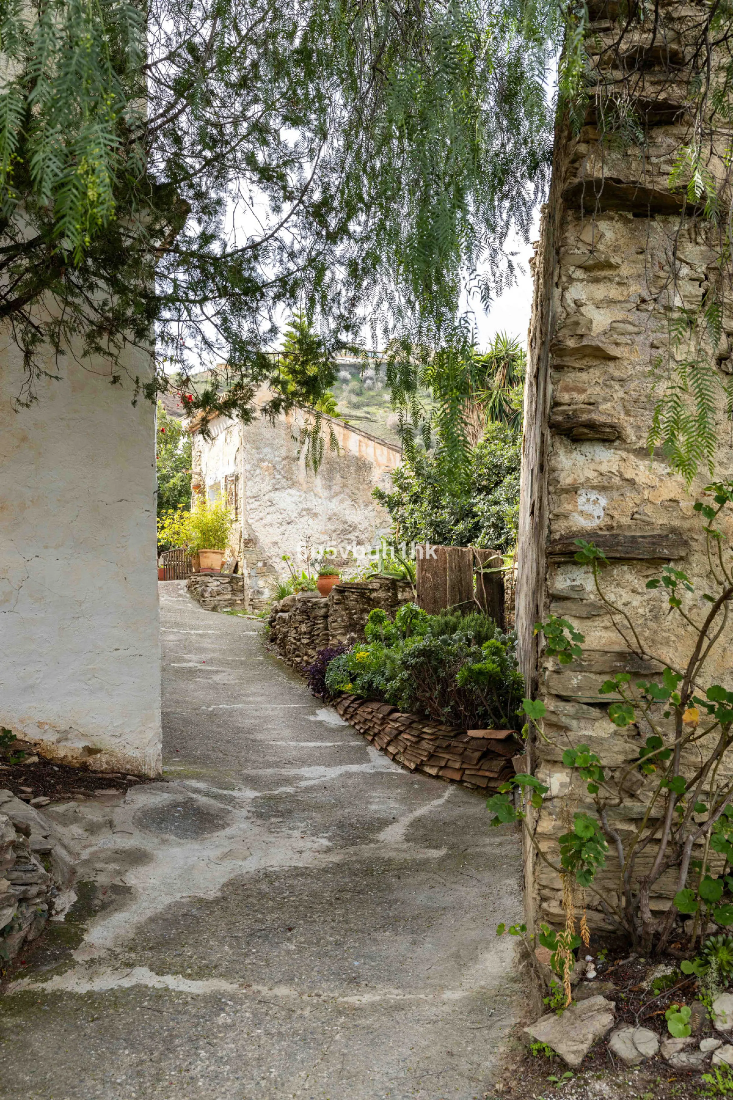 A very rare opportunity to purchase  a complete private village of 14 townhouses situated in what was once a functioning white countryside hamlet overlooking the lake with a lovely cobbled street leading to each house. These beautiful rustic style houses 