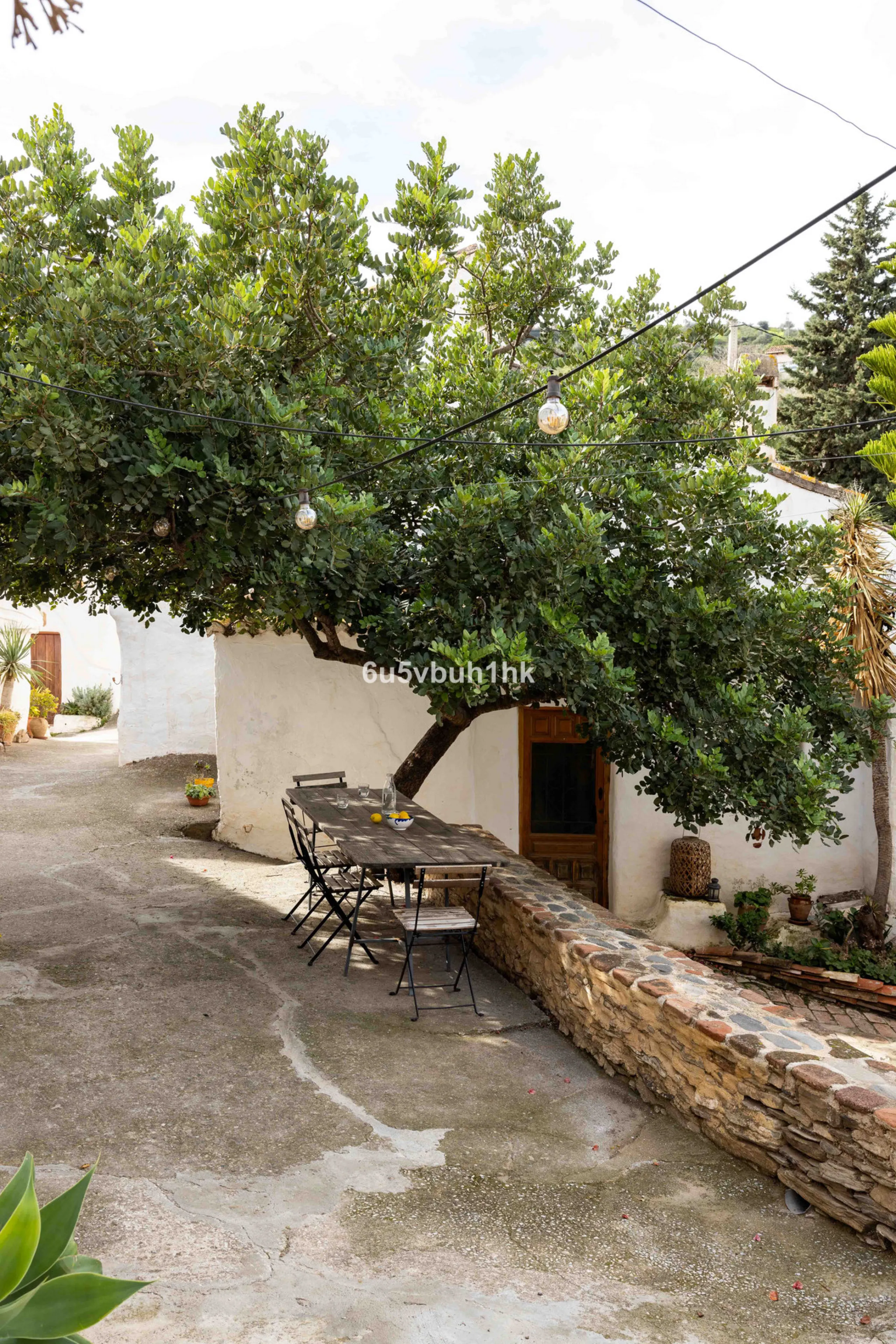 A very rare opportunity to purchase  a complete private village of 14 townhouses situated in what was once a functioning white countryside hamlet overlooking the lake with a lovely cobbled street leading to each house. These beautiful rustic style houses 