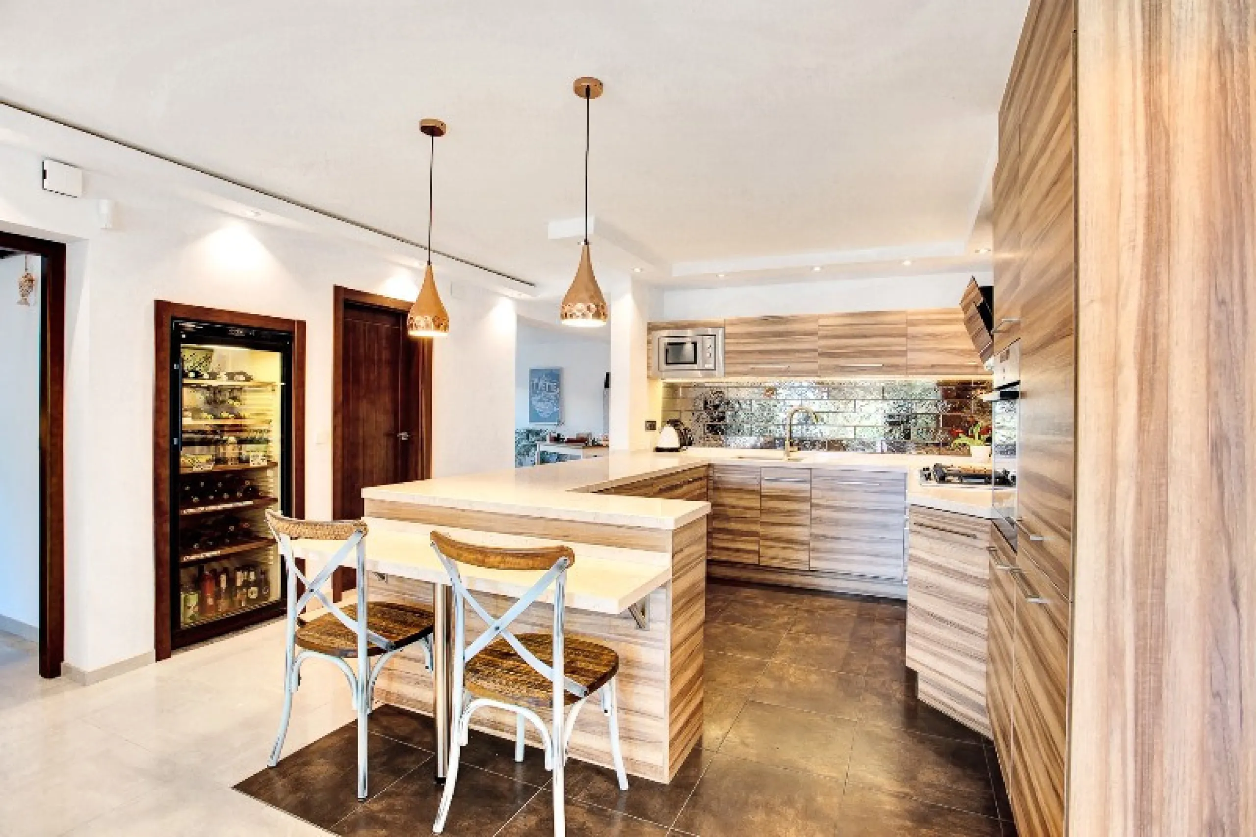 Luxury family villa in MARBESA, one of the most exclusive areas of Marbella. A desirable large open-plan villa on a flat south-west facing plot with mature landscaped gardens and large heated pool, and with wonderful panoramic sea views, only a few minute