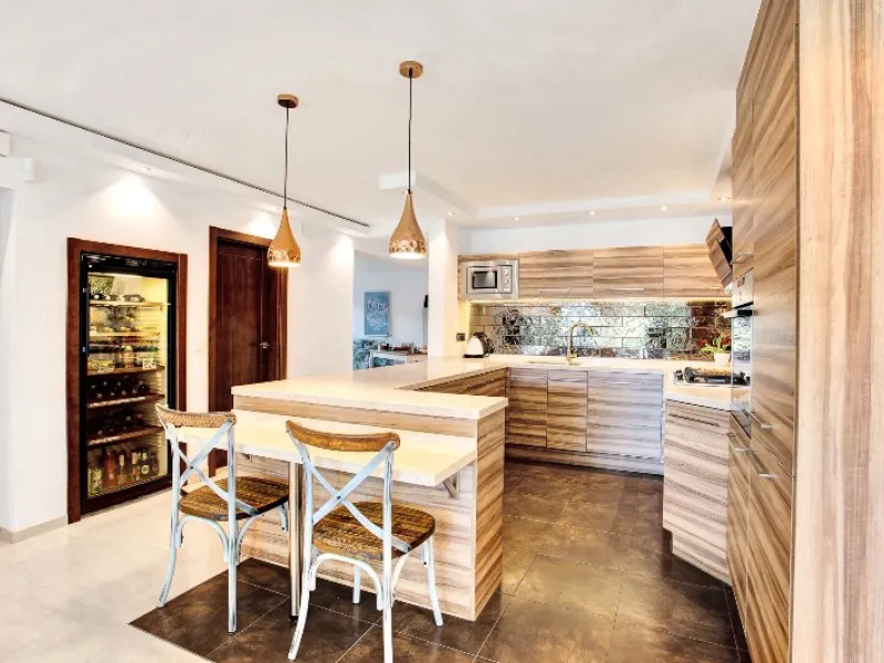 Luxury family villa in MARBESA, one of the most exclusive areas of Marbella. A desirable large open-plan villa on a flat south-west facing plot with mature landscaped gardens and large heated pool, and with wonderful panoramic sea views, only a few minute