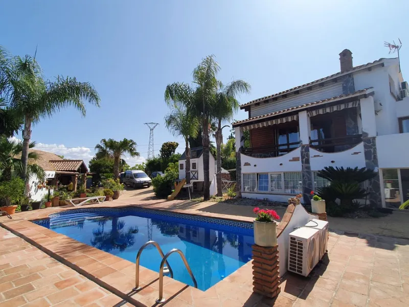 Charming Country Property for sale featuring two houses and two apartments, along with two swimming pools. This property holds a licence for rural tourism and is conveniently located very close to the town, surrounded by a fence ensuring privacy and secur