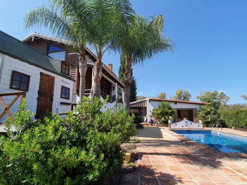 Charming Country Property for sale featuring two houses and two apartments, along with two swimming pools. This property holds a licence for rural tourism and is conveniently located very close to the town, surrounded by a fence ensuring privacy and secur