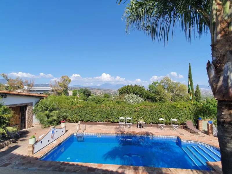 Charming Country Property for sale featuring two houses and two apartments, along with two swimming pools. This property holds a licence for rural tourism and is conveniently located very close to the town, surrounded by a fence ensuring privacy and secur