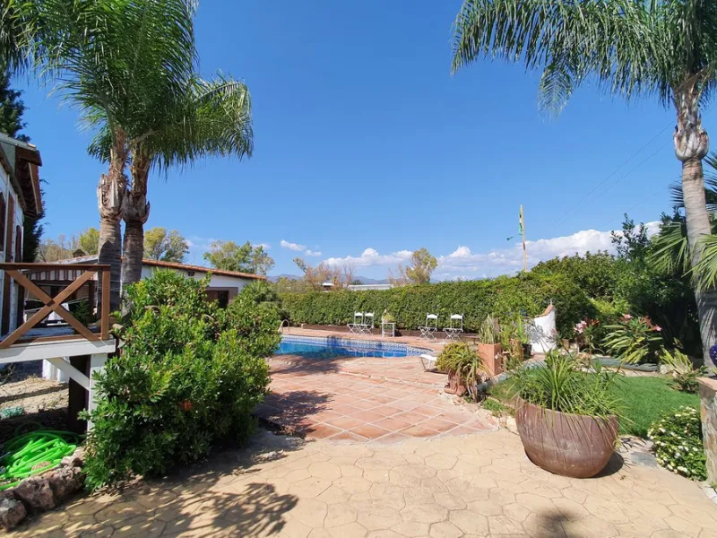Charming Country Property for sale featuring two houses and two apartments, along with two swimming pools. This property holds a licence for rural tourism and is conveniently located very close to the town, surrounded by a fence ensuring privacy and secur