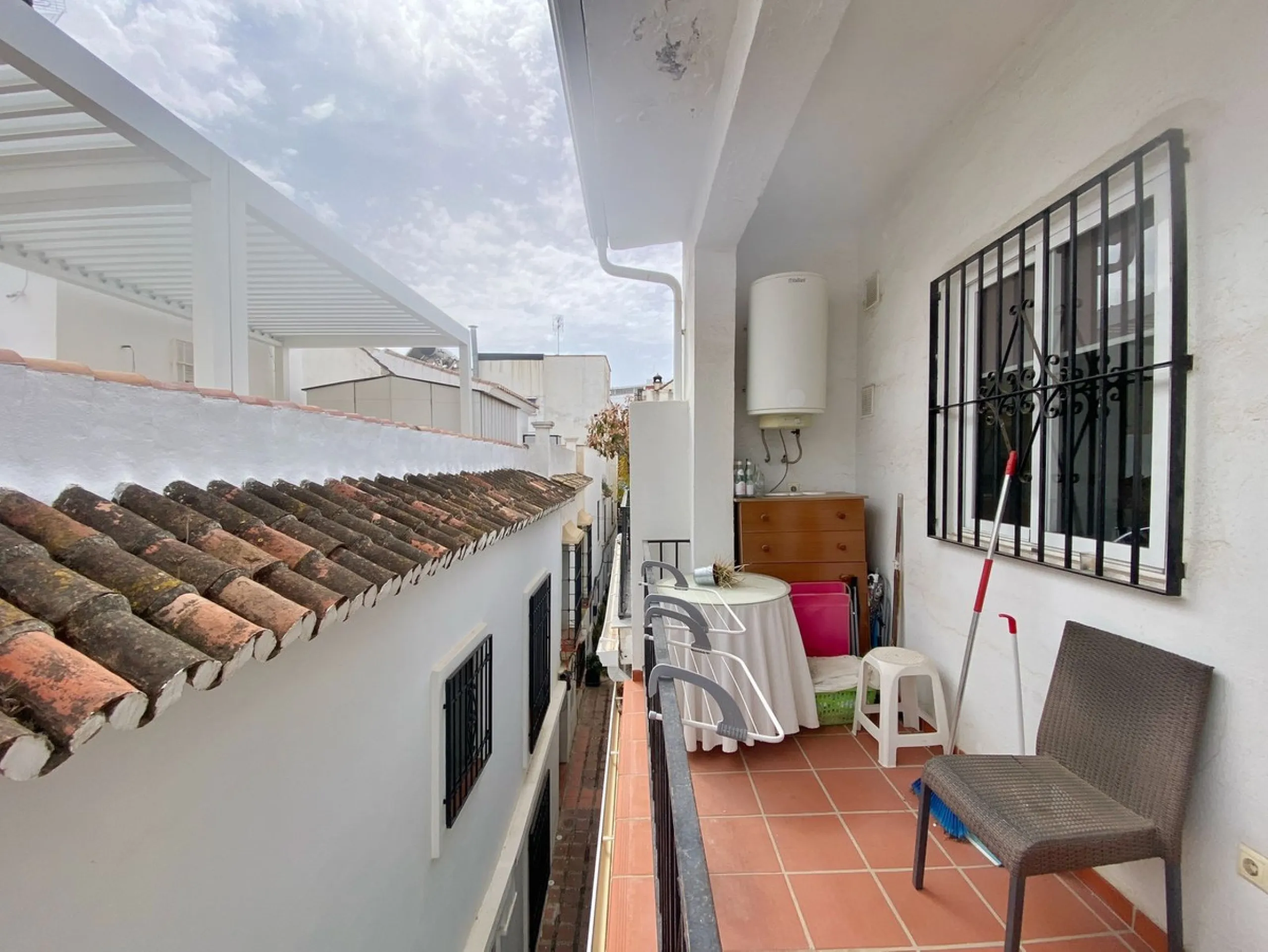 Spacious  town house with an interior patio and several rooms distributed between the two main floors.